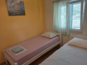 Postel nebo postele na pokoji v ubytování Apartman Jovici