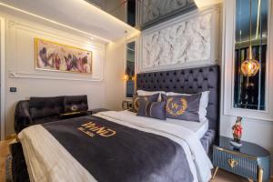 A bed or beds in a room at Wind Suit
