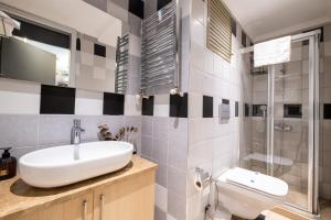 a bathroom with a sink and a toilet at Wind Suit in Istanbul