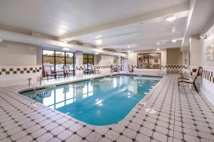 a large pool with blue water in a building at Hampton Inn West in Columbus