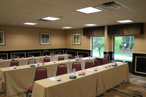 a conference room with rows of tables and chairs at Hampton Inn Long Island/Commack in Commack