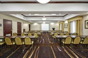 a conference room with tables and chairs and a podium at Hampton Inn & Suites Corpus Christi I-37 - Navigation Boulevard in Corpus Christi