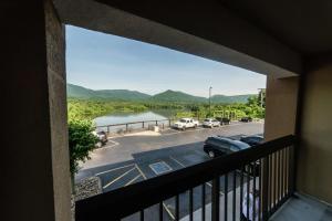 a balcony with a view of a parking lot and a lake at Hampton Inn Caryville-I-75/Cove Lake-State Park in Caryville