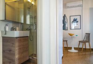 a bathroom with a sink and a shower at Breeze 1BD Apartment by BluPine in Athens