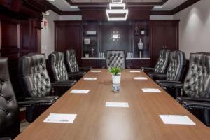 a conference room with a long table and chairs at Hampton Inn & Suites Dallas DFW Airport North Grapevine in Grapevine +22 photos