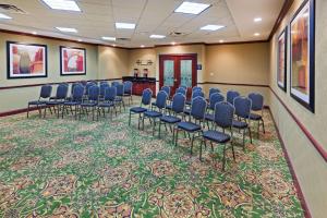 a conference room with blue chairs and a carpet at Hampton Inn and Suites Waxahachie in Waxahachie +31 photos