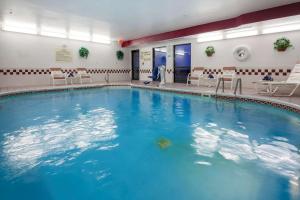 a large swimming pool with blue water in a building at Hampton Inn Dayton Fairborn Wright Patterson AFB in Fairborn