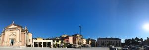a group of buildings on a city street at Casa Porto Vecchio in Peschiera del Garda