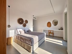 a bedroom with a large bed and a table at Villa Rojo in Santa Maria +115 photos