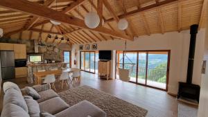 a large living room with a couch and a table at CASA DO SOL , Turismo Rural in Celorico de Basto