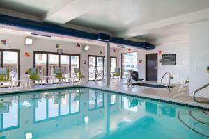 a large swimming pool with chairs and tables at Hampton Inn Denver-West/Golden in Golden