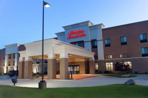 a hospital building with a sign on top of it at Hampton Inn & Suites Ankeny in Ankeny