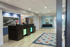 a lobby with a reception desk in a building at Hampton Inn & Suites Ankeny in Ankeny