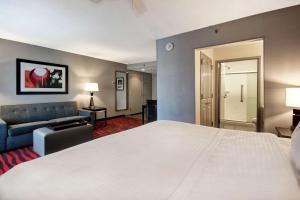 a hotel room with a large bed and a couch at Homewood Suites By Hilton Dubois, Pa in DuBois +57 photos