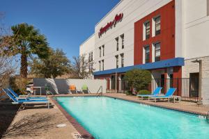 a swimming pool in front of a hotel at Hampton Inn Eagle Pass in Eagle Pass