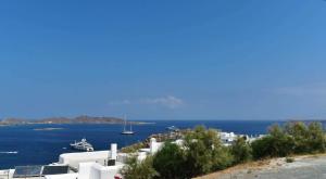 a view of the ocean and a cruise ship at Sea View Stone House in Naousa