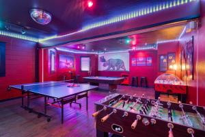 a ping pong room with two ping pong tables in it at HI Sacramento Hostel in Sacramento