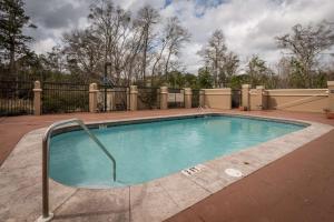 a large swimming pool with a metal rail around it at Hampton Inn Enterprise in Enterprise