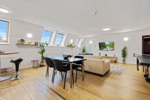 a living room with a table and a couch at Family Hub in Centre in Bratislava
