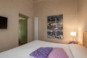 A bed or beds in a room at La Cucchetta