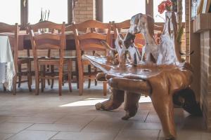 a statue of a dog sitting on a table at LA CASA NELLA PRATERIA in Misano Adriatico