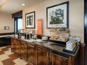 a buffet line in a hotel room with food at Hampton Inn Spring Lake Fayetteville in Spring Lake