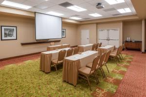 a conference room with tables and chairs and a screen at Hampton Inn & Suites Florence-North-I-95 in Florence +33 photos