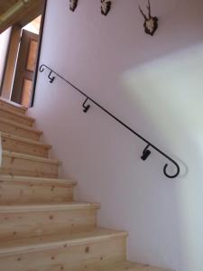 a set of stairs with a light hanging from the wall at Haus Erle in Peiting