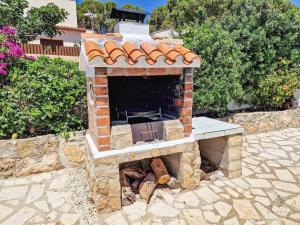 an outdoor brick oven with a fire place at Villa cerca del pueblo y playas de Moraira - Ref A022 AVANOA PREMIUM RENTALS in Moraira