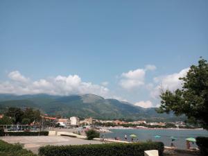 a view of a body of water with umbrellas at Home & Bed Spartano in Sapri