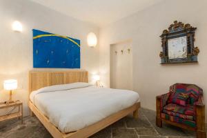 A bed or beds in a room at La Cucchetta