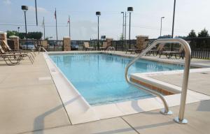 a swimming pool at a resort with a slide in it at Hampton Inn Gadsden/Attalla Interstate 59 in Gadsden