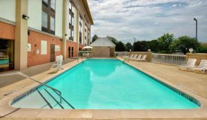a large swimming pool outside of a building at Hampton Inn Gaffney in Gaffney