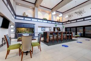 a large living room with a fish tank at Hampton Inn & Suites Galveston in Galveston