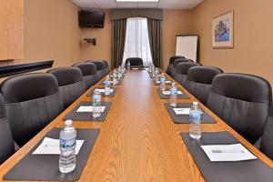a conference room with a long table with bottles of water at Hampton Inn Grand Island in Grand Island