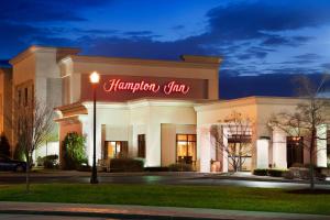 a hampton inn is lit up at night at Hampton Inn Geneva in Geneva
