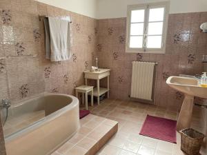 a bathroom with a tub and a sink at SICILIA VILLA in La Ciotat +74 photos