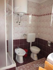 Koupelna v ubytování Apartment Jelić + 20 fotografií