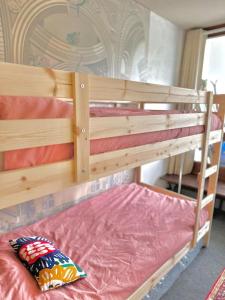 a wooden bunk bed with a pillow on top of it at La Valette in Isola