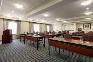 a conference room with tables and chairs and a podium at Homewood Suites by Hilton Harrisburg East-Hershey Area in Harrisburg +23 photos