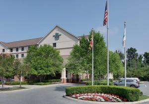 a building with an american flag in front of it at Homewood Suites Hagerstown in Hagerstown