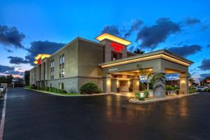 a hotel with a parking lot in front of it at Hampton Inn Houston Baytown in Baytown