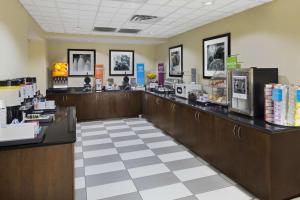 a fast food restaurant with a cash register and a counter at Hampton Inn Hinesville in Hinesville