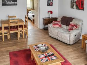 a living room with a couch and a table at Little London in Bognor Regis