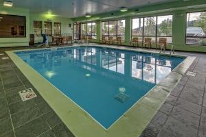 a large swimming pool with blue water in a building at Hampton Inn Ashland in Ashland