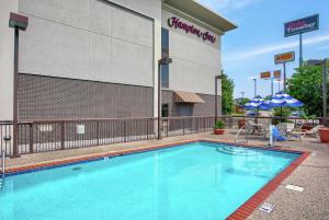 a swimming pool in front of a hotel at Hampton Inn Cullman in Cullman