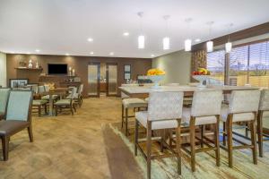 a dining room with a large table and chairs at Hampton Inn Terre Haute in Terre Haute