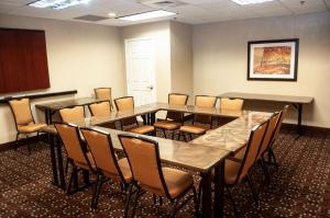 a conference room with a table and chairs at Hampton Inn Terre Haute in Terre Haute +21 photos