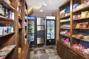 a grocery store aisle with a refrigerator and lots of food at Hampton Inn Idaho Falls in Idaho Falls
