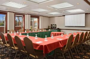 a conference room with a table and chairs and a screen at Homewood Suites by Hilton Wilmington-Brandywine Valley in Talleyville +40 photos